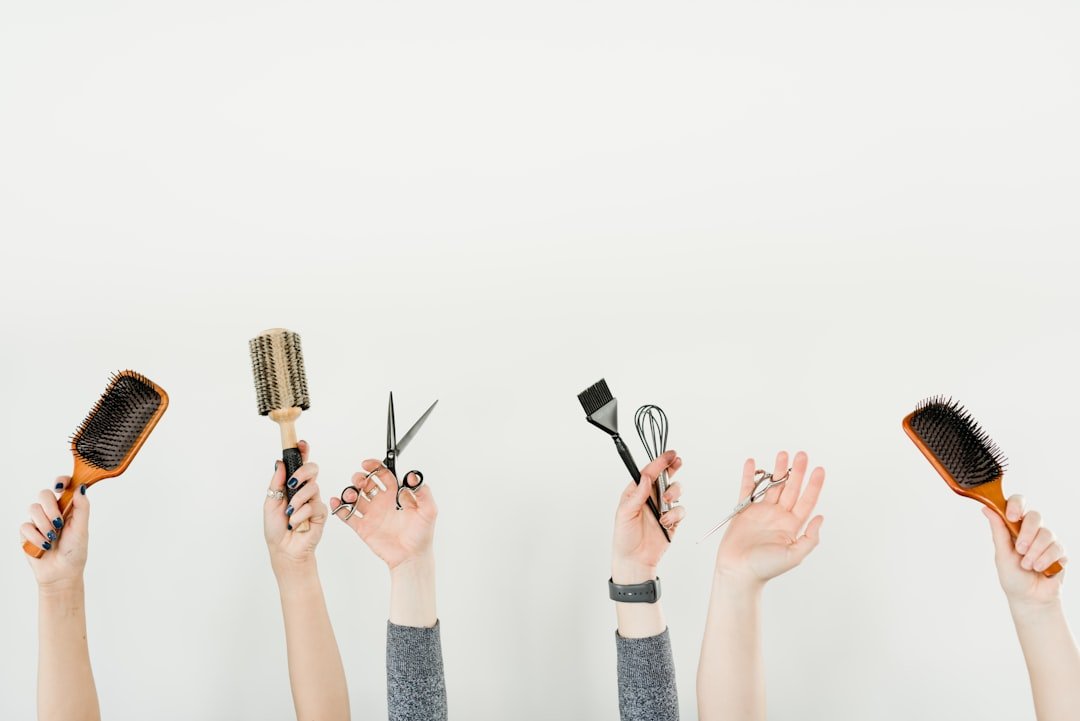 Different hair brushes and combs arranged for comparison