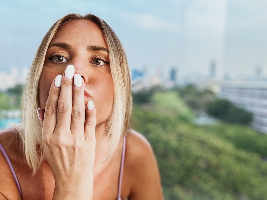 Woman applying sunscreen as part of a morning routine